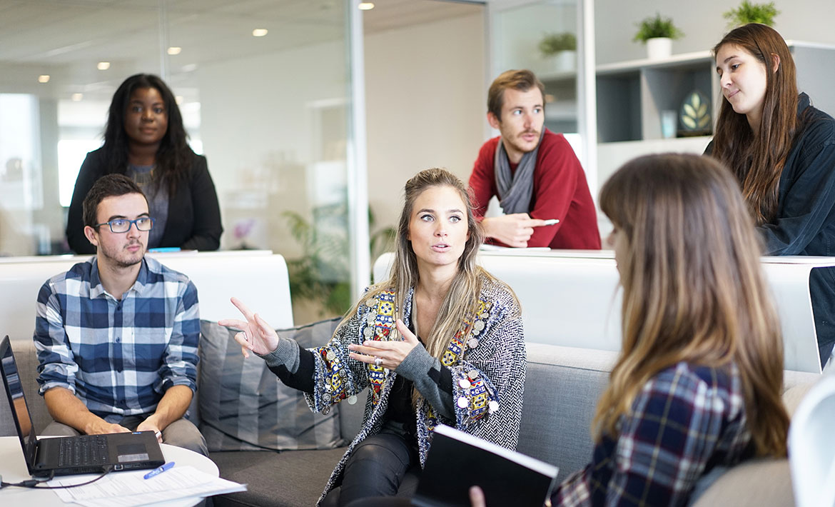 A team of professionals collaborating in a meeting, representing the dedicated approach of a buyers agent team working together to secure the best investment property deals.