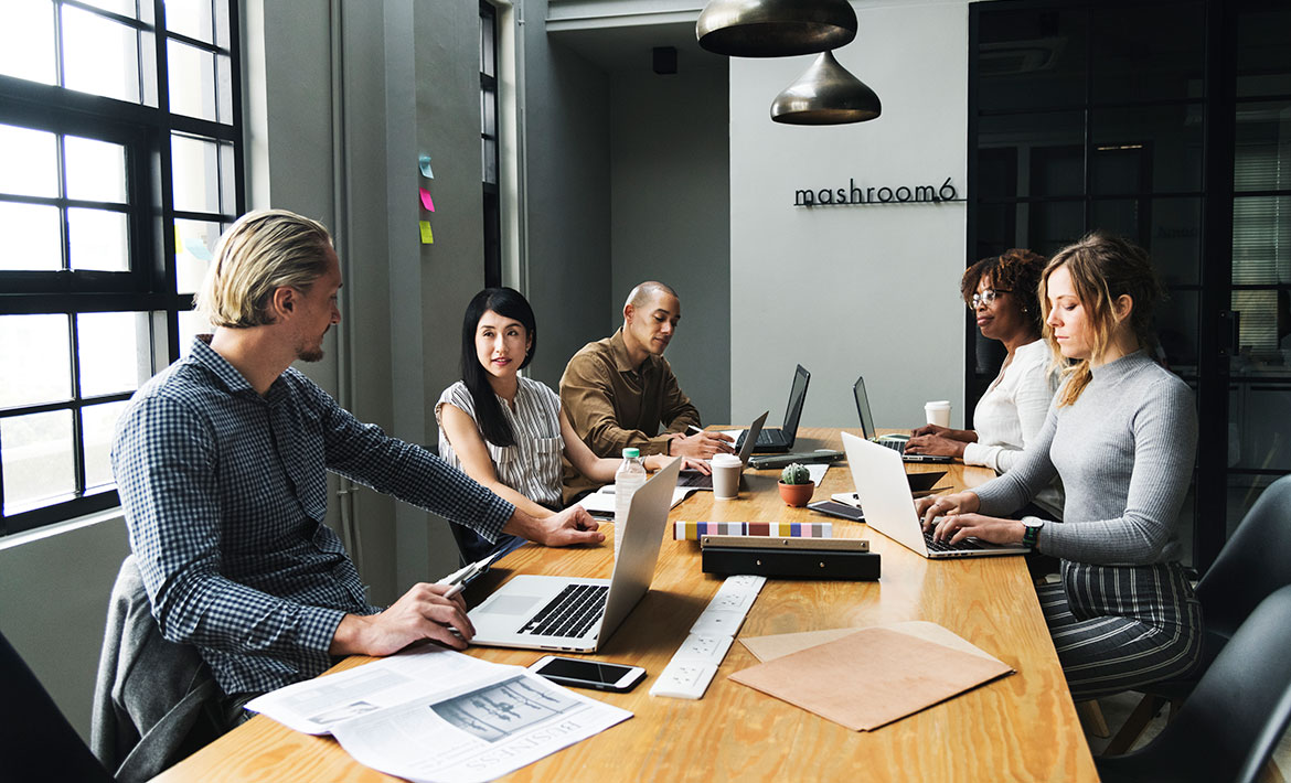 Experienced negotiators discussing property deals, representing the expert negotiation skills of a buyers agent to secure the best outcomes for clients.